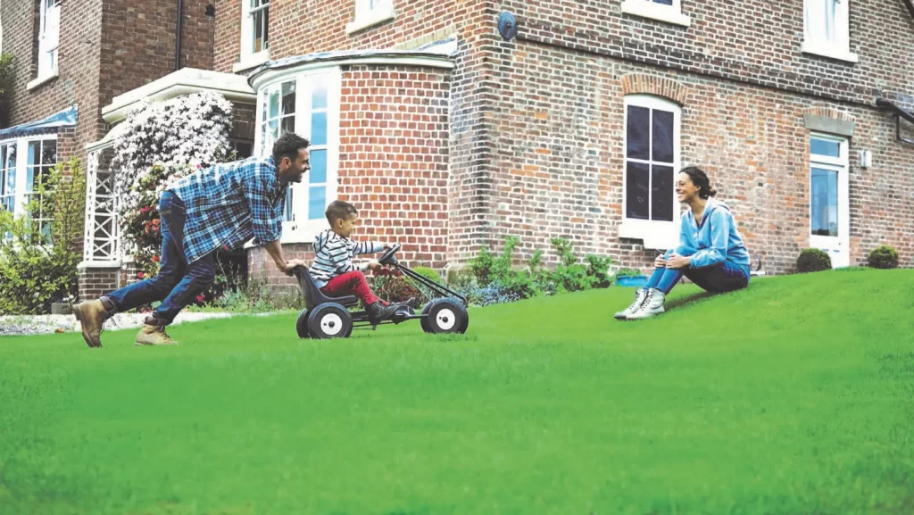A picture of a family enjoying a well maintained lawn, Lawnscience Aberford Lawn Care
