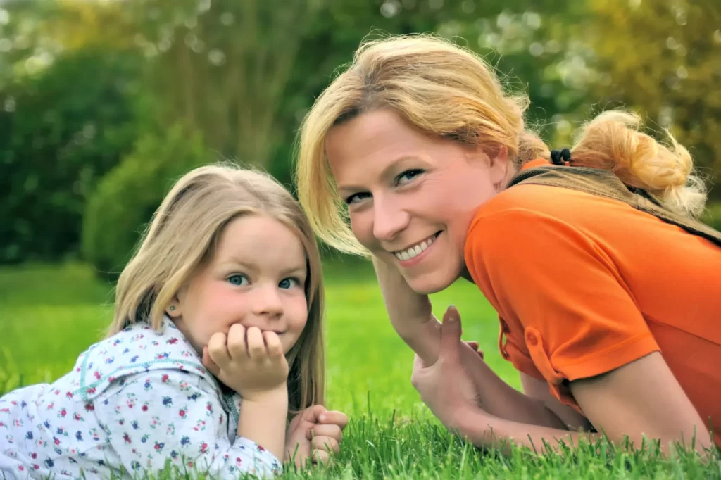 A picture of a mother and daughter enjoying a beautiful lawn, Lawnscience Lawn Care Bramham